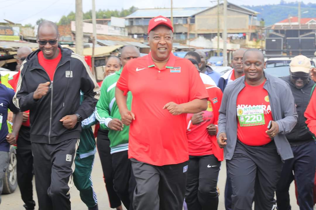 Nyamira Governor Amos Nyaribo (with gun) starts the 21km Nyamira County Great run race at Chebilat on Sunday April 30, 2023